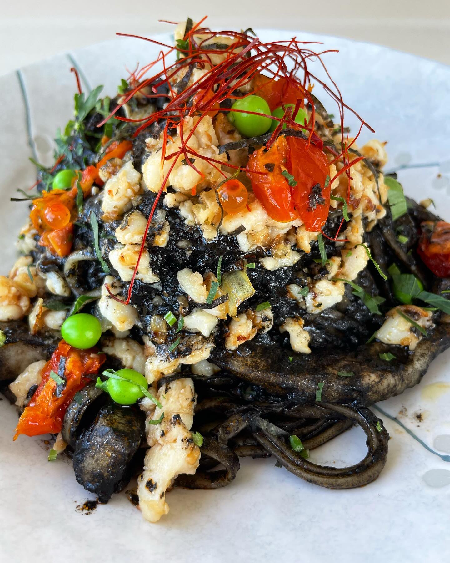 Limited special

Squid ink linguine .
Calamari, blue swimmer crab meats, semi dried tomato, garden pea

Come for lunch/dinner to try our Japanese Italian fusion.